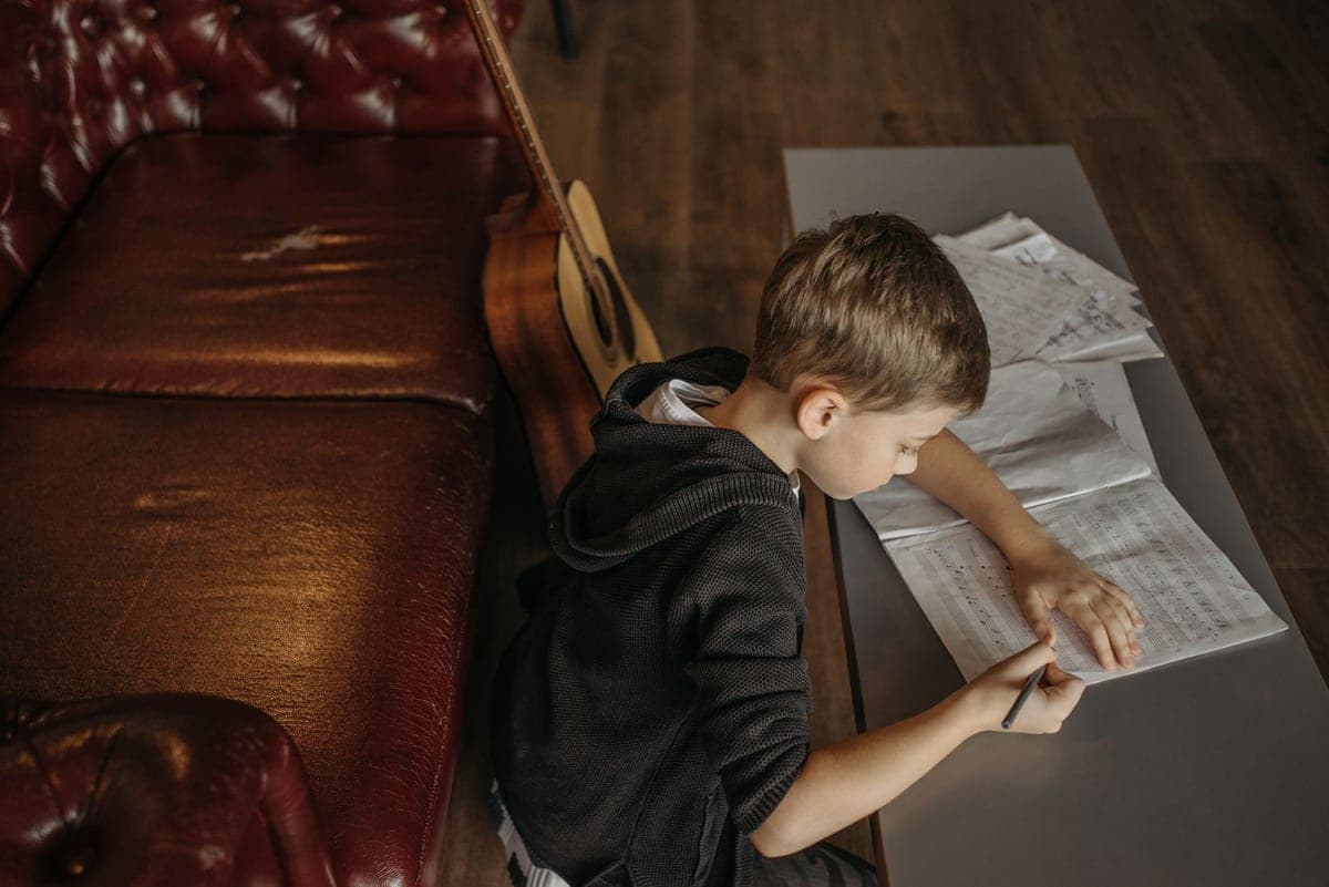 A child working through a music lesson at home
